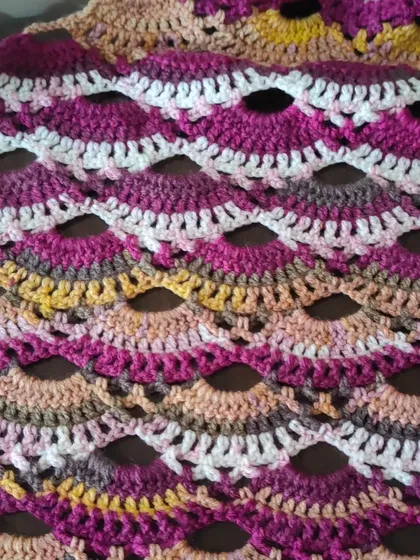A macro shot of the Virus Shawl's scalloped rows.