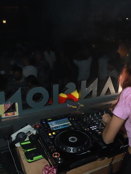 A view from behind the decks at Mansion, showing my perspective as I control the music for the entire club.