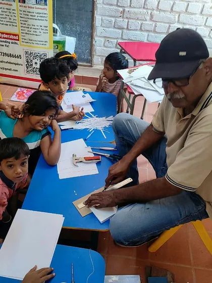 Learning is a community activity. Here, our mentor Ashok Urs is surrounded by curious young minds during a bookbinding workshop. We create a supportive and engaging atmosphere where children feel comfortable exploring, asking questions, and learning together.