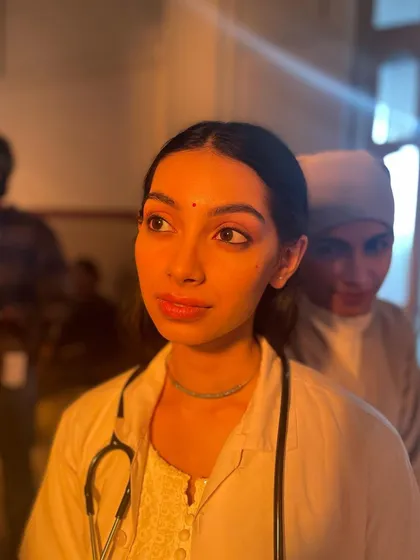 In character as Bhama, a doctor, on the set of 'Dange/Por'. The role required a lot of internal shifts, and this is a candid shot between takes, staying in that focused headspace.