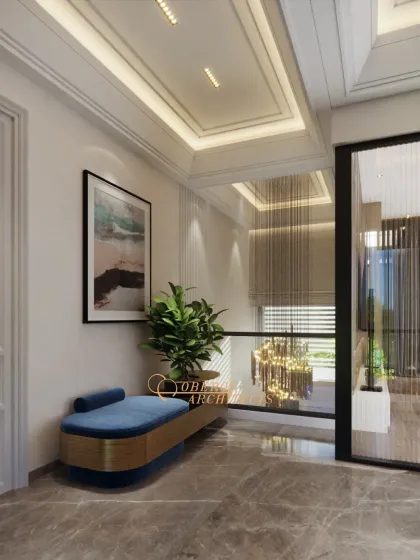 A cozy and stylish seating nook in a hallway, featuring a blue velvet bench and modern art, turning a passageway into a functional resting spot.