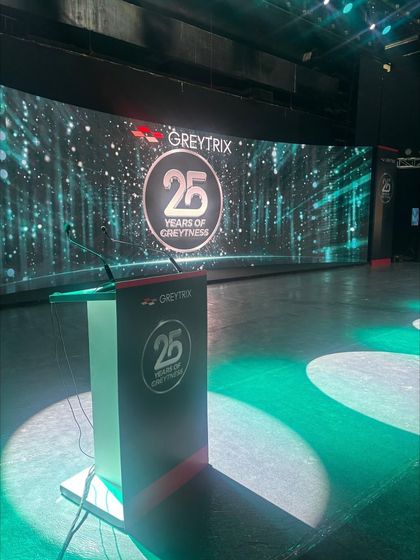 The stage is set for the Greytrix 25 years celebration, with the podium and main screen ready for the show.