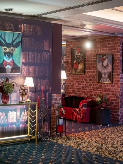 Step into the mystery of a 1920s 'Masquerade Speakeasy'. With moody lighting, vintage library walls, and plush velvet seating, I crafted an immersive experience where every corner holds a secret and the past feels present.
