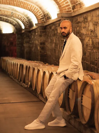 Posing in the arched wine cellar in Tuscany. It's not every day you get to DJ at a venue with its own historic winery.