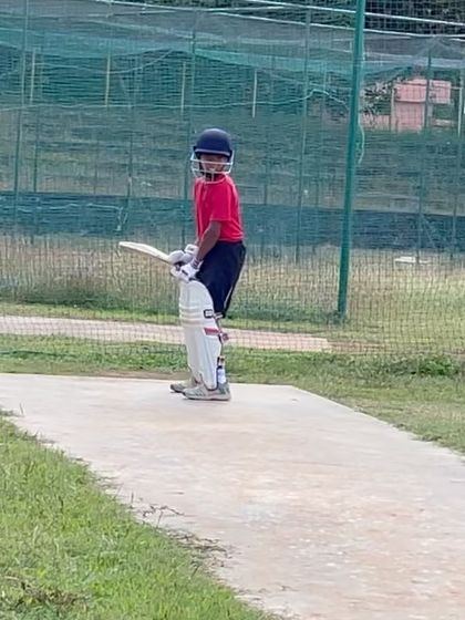A young Arnav focused during a practice session. This early start, inspired by his uncle, laid the foundation for his cricketing journey.