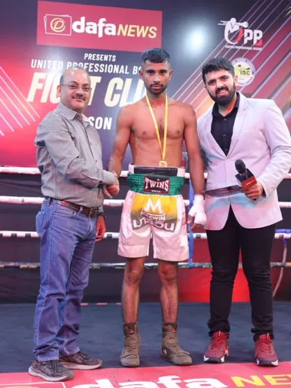 A winner being recognized at the Fight Club event. Every fight is a learning experience on the path to becoming a champion.