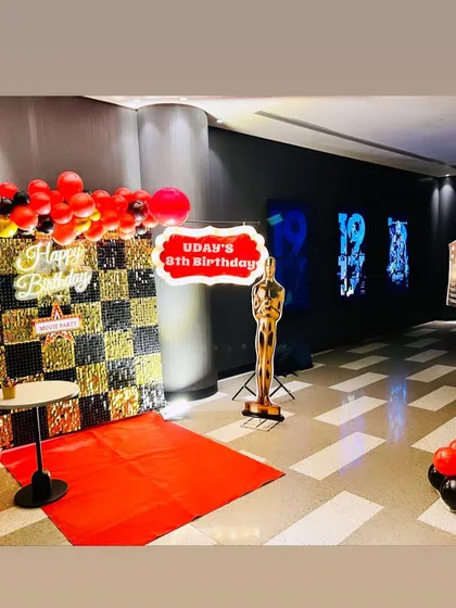 We brought the glamour of the movies to an 8th birthday with this Bollywood theme decoration. The setup included a red carpet entrance, a custom birthday sign, an Oscar statue prop, and a movie clapperboard for the perfect themed photo op.