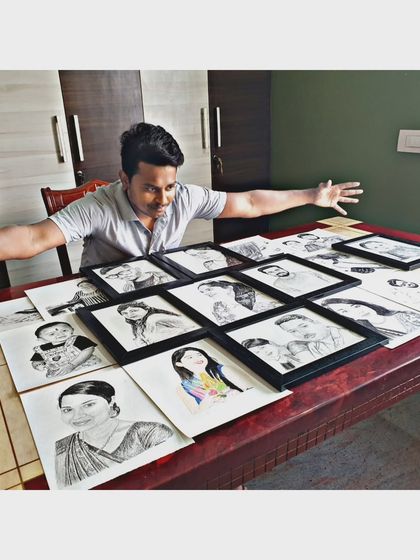 A throwback to 2020, with a table full of my early sketches. It's amazing to see how far my art has come.