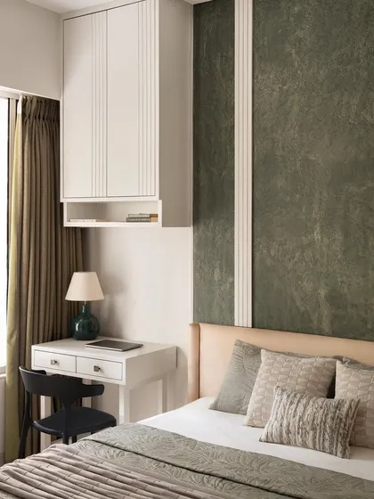 A bedroom in the Olive Haven part of the project, featuring olive shade concrete texture and brass inlays.