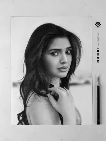 Here is the final realistic pencil sketch of actress Krithi Shetty. This piece took over 20 hours to complete on A4 size Strathmore Bristol paper, using a mix of graphite and charcoal to capture her likeness and expression with precision.