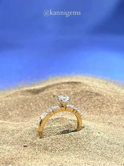 The perfect beach proposal begins with the perfect ring. This solitaire diamond, set on a band of baguette diamonds, is designed to sparkle as brightly as your future together.