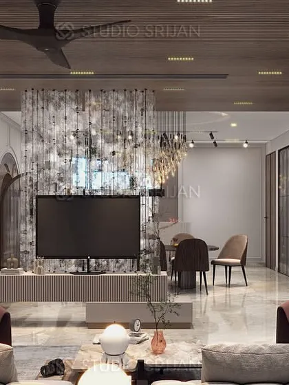 This Janakpuri living room combines a wooden ceiling with a unique, textured TV partition. The color palette of warm browns and grays creates a cozy and sophisticated environment.