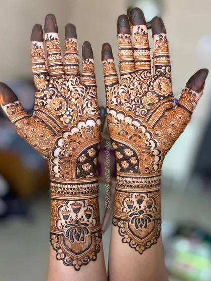 A beautiful lotus-themed design for an engagement, with delicate patterns covering the hands and wrists.
