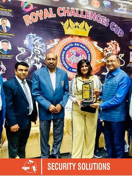 Dignitaries and our director present an award at the Royal Challengers Karate Cup. We welcome and host officials from major sports organizations like the Indian Olympic Committee.