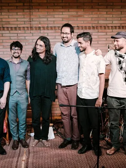 A group photo of the REFUGE ensemble with other festival musicians, showcasing the camaraderie and community spirit of the Koota Jazz Festival.
