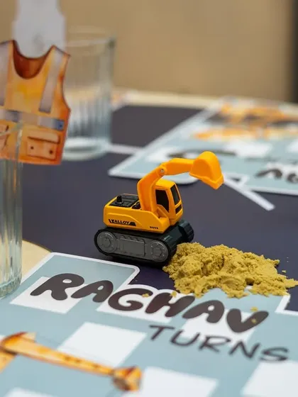 A repeat of a great detail shot, showing the excavator toy and personalized placemat that made the theme so special.