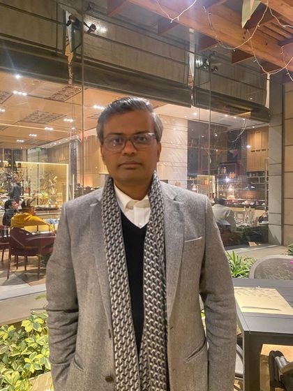 A candid portrait taken during a moment of brief respite from my professional duties.