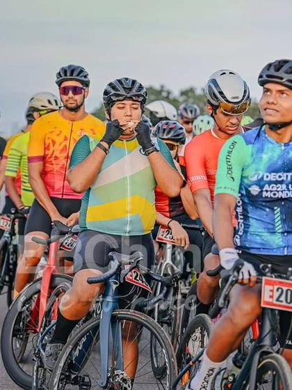 Riders getting ready at the start line, a moment of calm before the storm of the race begins.