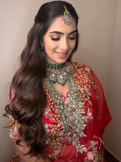 A beautiful smile completes the look. This is what it's all about, creating a look that makes the bride feel confident and joyful.
