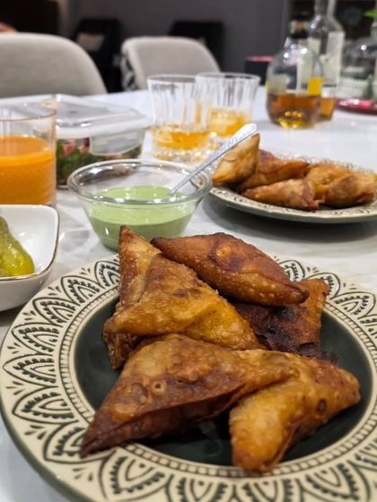 Crispy Chicken Samosas served with green chutney and pickles. This is going to be the next star appetizer in my kitchen, perfect for any party.