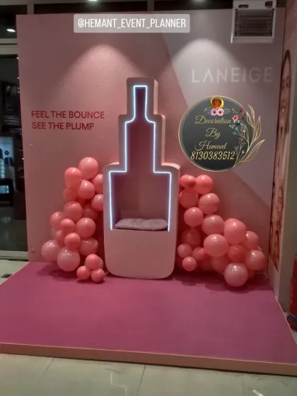 For the brand Laneige, I created this unique photo booth shaped like their product bottle. The custom-built prop includes neon light outlining and is surrounded by simple pink balloons, making it a perfect spot for brand promotion and guest photos.