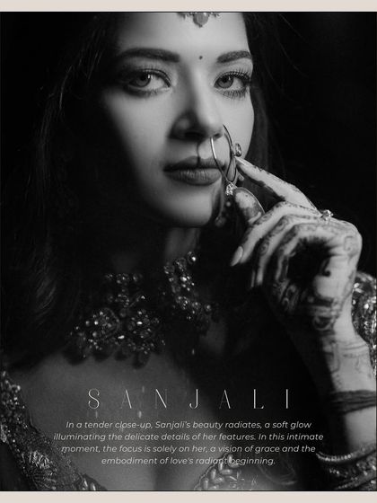 A powerful black and white close-up of Sanjali. This intimate portrait focuses on her expressive eyes and the delicate details of her nose ring, creating a timeless and striking image.