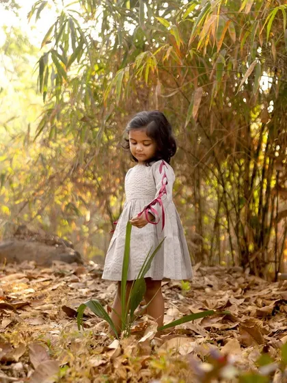 A quiet moment of exploration during her third birthday shoot. I love watching children interact with nature, as their curiosity leads to beautiful and serene photographs.