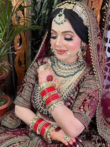 A close-up of the eye makeup on this bride. The soft gold and bronze glitter catches the light beautifully, making her eyes the star of the show.
