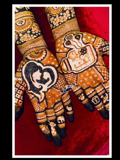 The palms of this design are so special. One hand has a silhouette of a mother kissing her baby, and the other has a baby in a cradle with the family name.