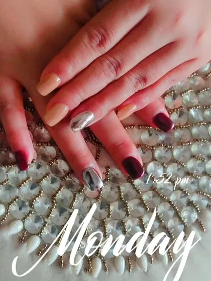 A different view of this multi-finish set, showing the contrast between the glossy maroon, the creamy nude, and the high-shine silver chrome.