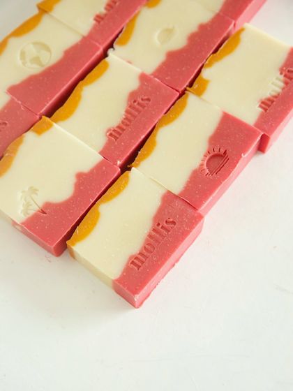 The 'mollis' stamp on the 'Herbal Revival' bars, a mark of their handcrafted quality.