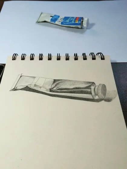 A still life sketch of a tube of paint. Drawing everyday objects like this is great practice for observing light, shadow, and form.