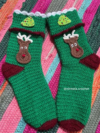 Get into the holiday spirit with our Christmas-themed stockings. This pair features a cute reindeer and a little Christmas tree, perfect for festive celebrations.