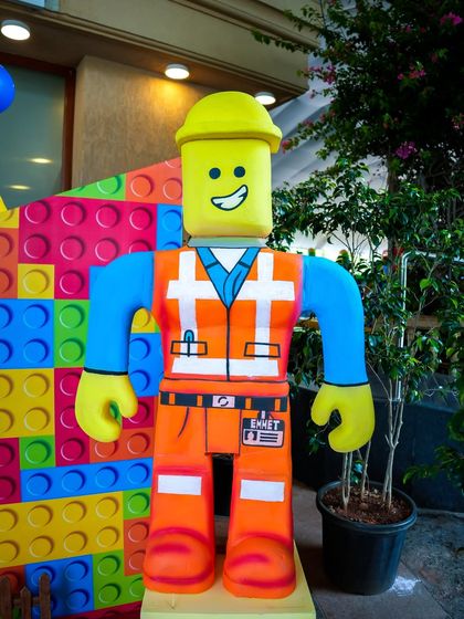 A life-sized prop of Emmet from The LEGO Movie, perfect for photo opportunities.