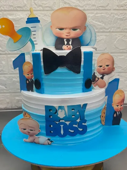 The Boss Baby is a super popular theme for first birthdays. For this two-tier cake, I used sharp blue and white colors and multiple character cutouts to create a fun and impressive centerpiece for the little boss's big day.