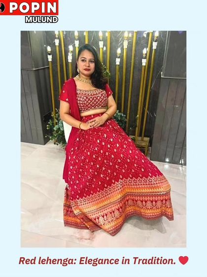 A client looking elegant and poised in a classic red printed lehenga. This timeless look is perfect for any traditional wedding ceremony.