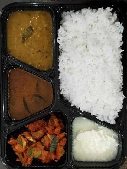 A packed veg meal with dal, a dry vegetable fry, a gravy curry, rice, and curd. My daily menus are always changing.