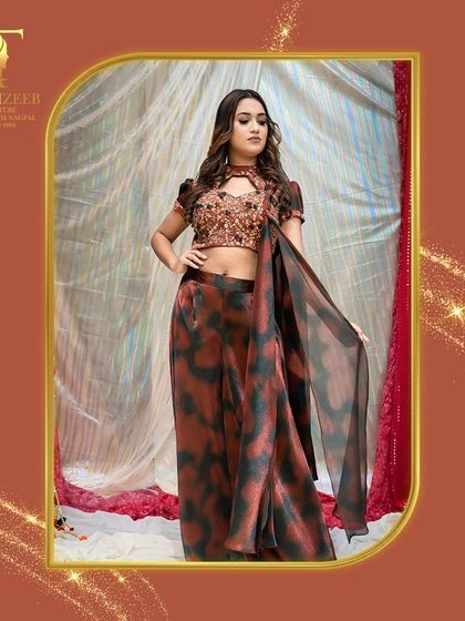 A full-length shot of this beautiful tie-dye pant-saree. The sequined blouse and modern drape make it a unique and stylish choice for any festive occasion or wedding party.