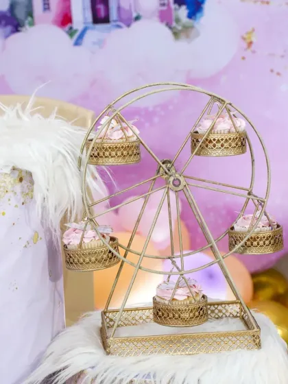 For the Rapunzel party, the cupcakes were displayed on this adorable miniature ferris wheel. It's a great example of how my treats can be integrated into your party's decor.