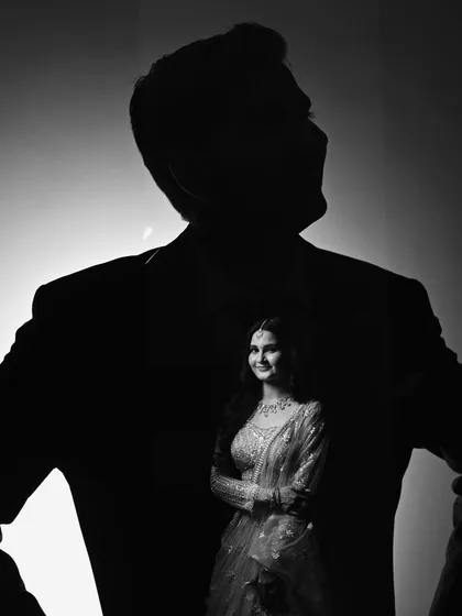 A creative double exposure blending the bride within the silhouette of her groom. A beautiful artistic representation of two souls becoming one.