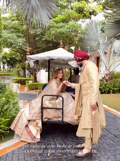 Creating picture-perfect moments is my passion. Here, the coordinated ivory outfits of the bride and groom create a stunning visual against the palace backdrop, telling a story of shared elegance and a love that lasts forever.