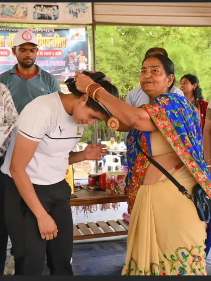 A moment of victory and respect. One of our senior members awards Saniya Khan her gold medal after a dominant performance in the championship.