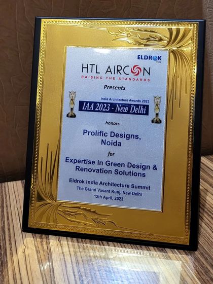 The India Architecture Awards (IAA) 2023 plaque, honoring Prolific Designs for 'Expertise in Green Design & Renovation Solutions'. Sustainability is at the core of our design philosophy.
