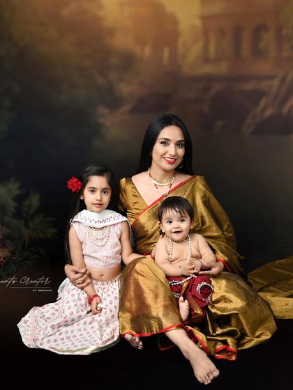 A mother's love, surrounded by her two children. This traditional family portrait is elegant, timeless, and full of cultural richness.