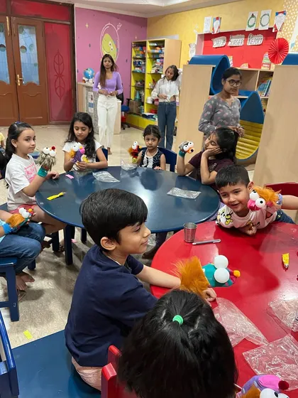 More fun and games from our puppetry camp. The children are fully engaged, working on their puppets at the craft tables.