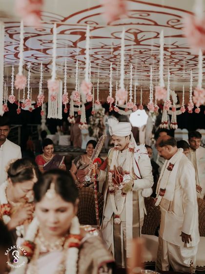A candid shot of the groom during the Kashi Yatre ritual, capturing the fun and traditional aspects of a South Indian wedding.