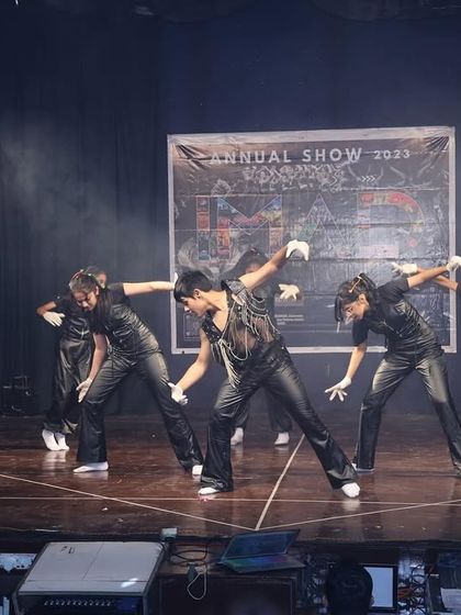 A synchronized move from the pop-inspired act, showcasing the precision and style of our teen dancers.