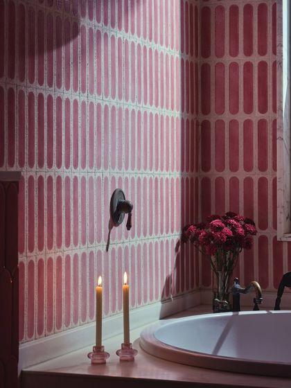A detail of the mulberry bathroom, where candlelight flickers against the custom tiles. This space is designed not just to function, but to feel, a place where color becomes comfort and rituals turn into memory.