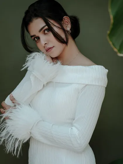 An elegant indoor portrait that showcases my use of soft, simple lighting to create a gentle and sophisticated mood. The focus here is on the subject's serene expression and the delicate textures of her outfit.