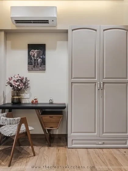 This modular wardrobe combines closed storage with an open carcass section for display and easy access. The piece is finished in a PVC European membrane, offering a durable and elegant solution that is tailored to the client's needs.